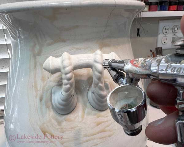 After matching colors, apply acrylic paint using airbrush 