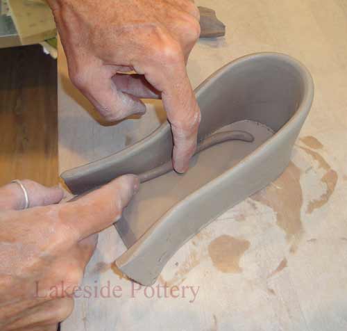 a small clay coil will reinforce a joined edge