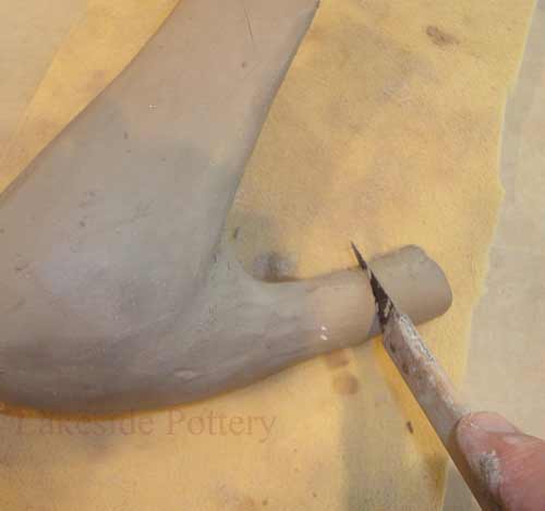 cut excess clay to desired height