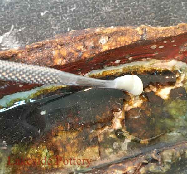 Carfully apply the mixed PC-SuperEpoxy Filler to the deep cavity