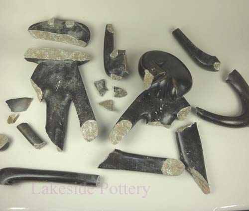 African "The thinker" sculpture broken