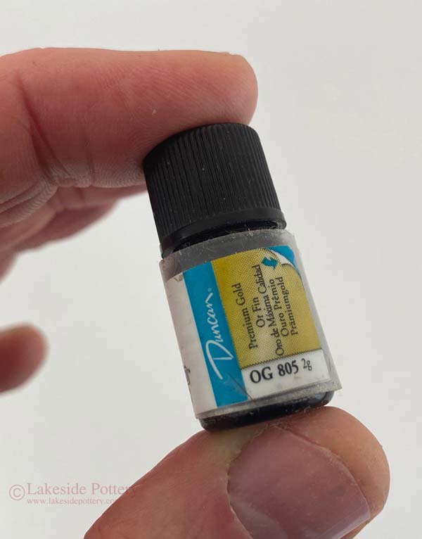 Using Duncan OG 805 Premium Gold overglaze fired to about 1,300 degrees F (cone 18).