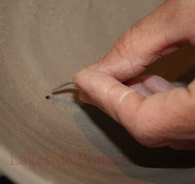 plug hole with rolled up clay